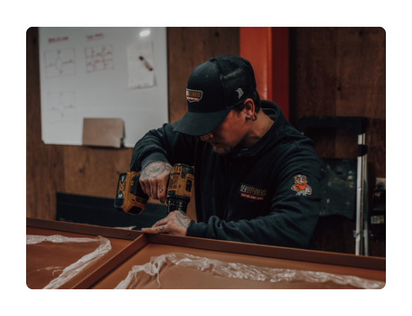 In-house manufacturing and installation by Den Defenders showcasing American-made security and storm doors built for quality